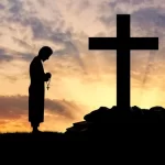 depositphotos_85770146-stock-photo-silhouette-of-priest-and-cross